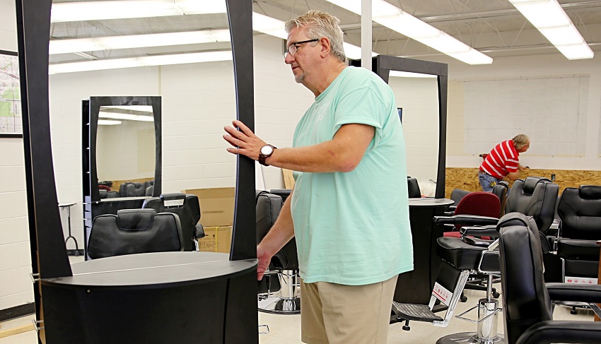 David Long sets up equipment for East Mississippi Community College’s new Barbering program. Long will oversee both the Cosmetology and Barbering programs at EMCC. Classes begin in August and a few spots in the Barbering program are still available. David Long sets up equipment for East Mississippi Community College’s new Barbering program. Long will oversee both the Cosmetology and Barbering programs at EMCC. Classes begin in August and a few spots in the Barbering program are still available.