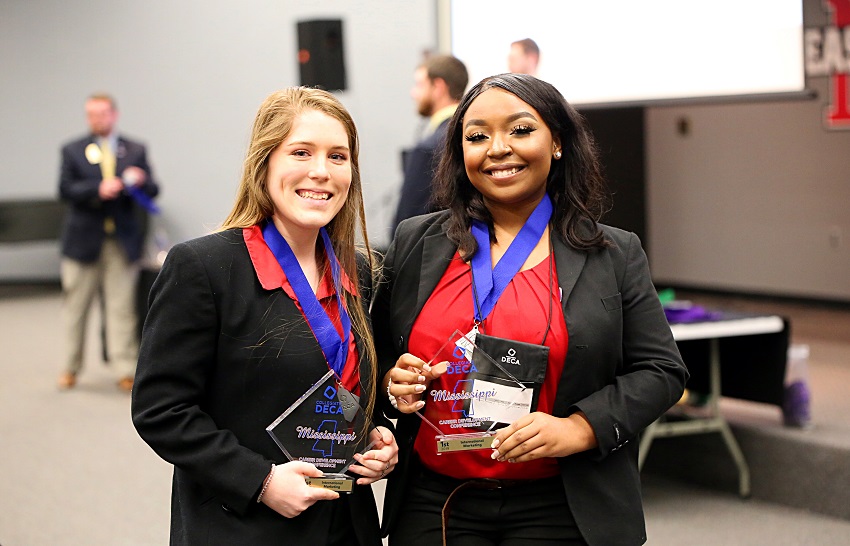 East Mississippi Community College students Laney Horne of Gulfport, at left and Destiny Jefferson-White of West Point and took first place in the International Marketing category during the Mississippi Collegiate DECA’s 2019 Career Development Conference. EMCC students won awards in 14 categories during the competition. East Mississippi Community College students Laney Horne of Gulfport, at left and Destiny Jefferson-White of West Point and took first place in the International Marketing category during the Mississippi Collegiate DECA’s 2019 Career Development Conference. EMCC students won awards in 14 categories during the competition.