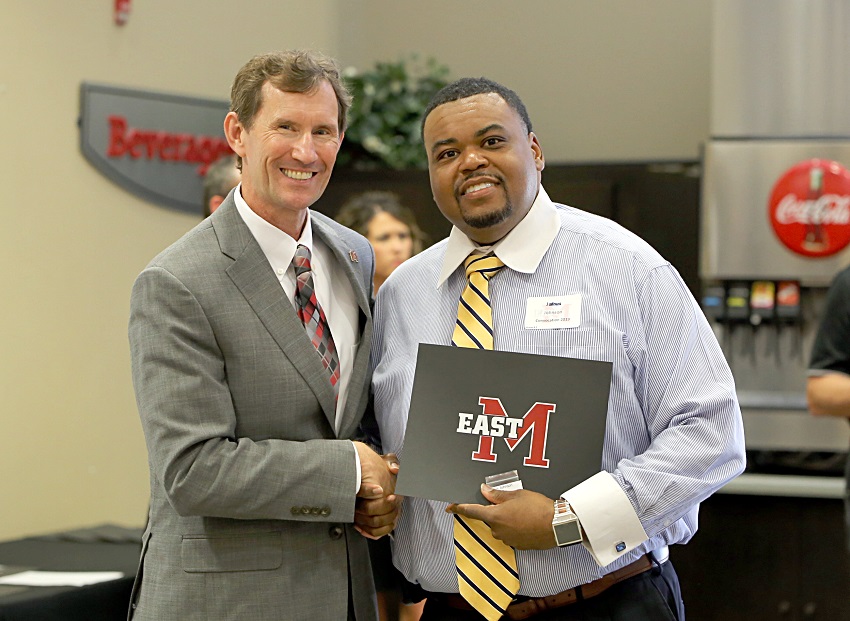 EMCC Math and Science Scooba Campus Division Chair Jairus Johnson is presented a service award certificate for his 15 years of employment with the college by EMCC President Dr. Scott Alsobrooks. Johnson was among 32 EMCC employees presented service awards Aug. 12 during the college’s annual convocation. EMCC Math and Science Scooba Campus Division Chair Jairus Johnson is presented a service award certificate for his 15 years of employment with the college by EMCC President Dr. Scott Alsobrooks. Johnson was among 32 EMCC employees presented service awards Aug. 12 during the college’s annual convocation.
