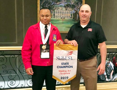 East Mississippi Community College student Bryson Jenkins of DeKalb, at left, took first place in Welding Sculpture in the Mississippi SkillsUSA Championships in Jackson. He is enrolled in the Welding Technology Program at the college’s Scooba campus, which is taught by welding instructor Shane McDaniel, at right. East Mississippi Community College student Bryson Jenkins of DeKalb, at left, took first place in Welding Sculpture in the Mississippi SkillsUSA Championships in Jackson. He is enrolled in the Welding Technology Program at the college’s Scooba campus, which is taught by welding instructor Shane McDaniel, at right.